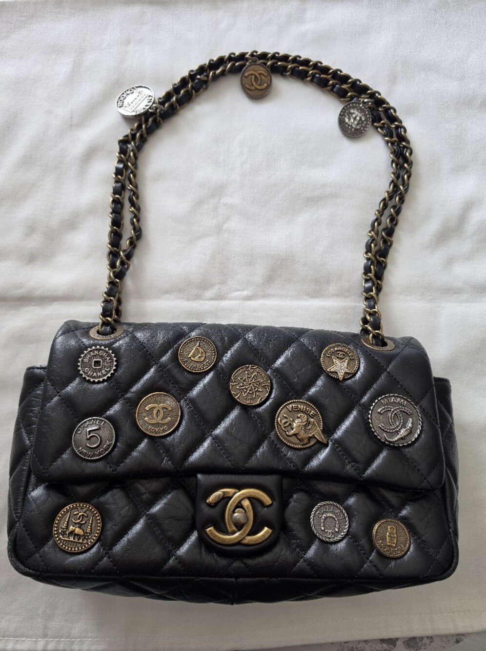 Black Quilted Shoulder Bag with Mixed Metal Medallion Accents